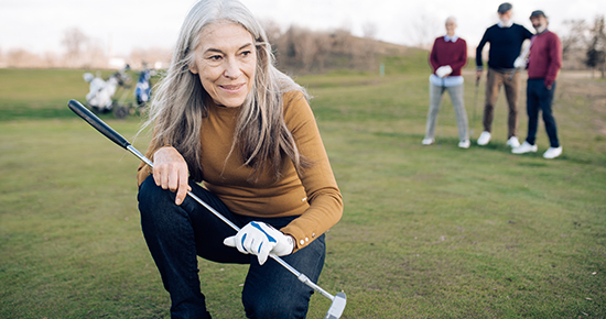 Portrait of a senior woman who took a golf shot