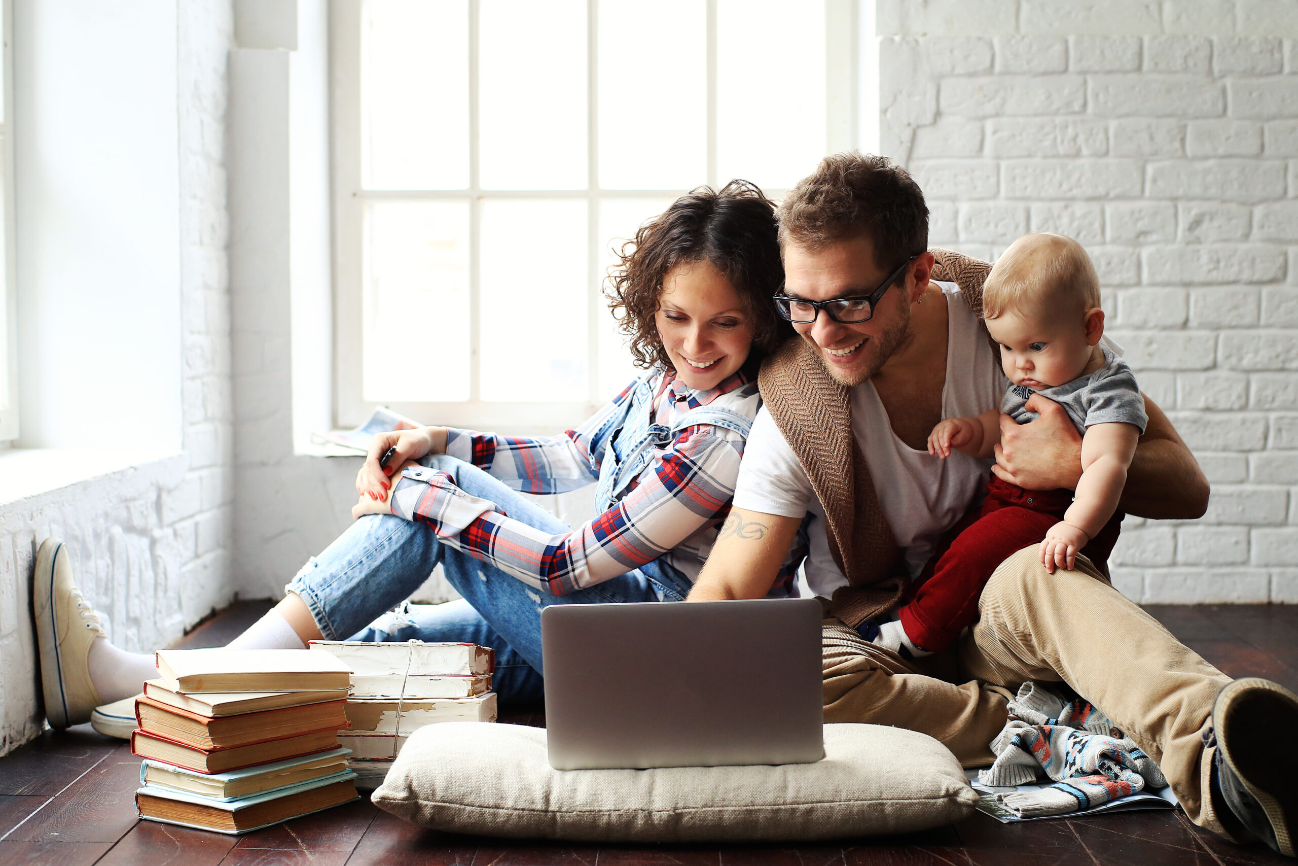 Young family researching on laptop