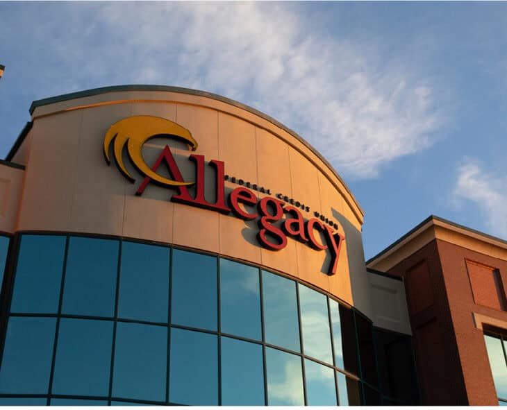 Allegacy headquarters building and sign at dusk