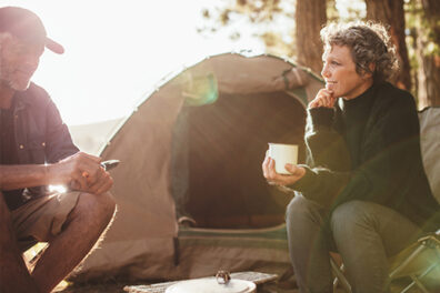 couple camping in woods