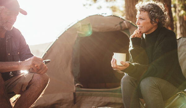 couple camping in woods