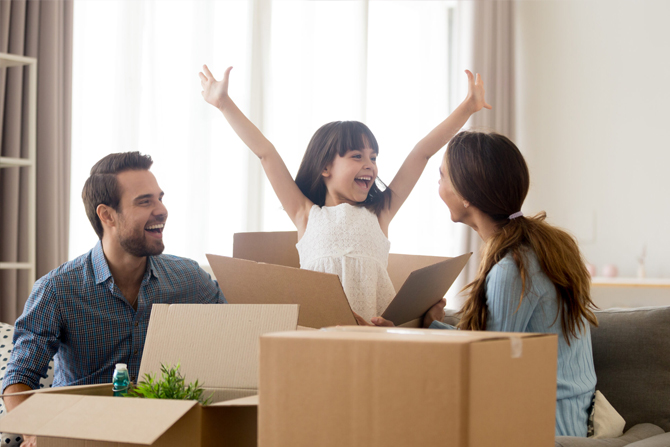 Child jumping out of box