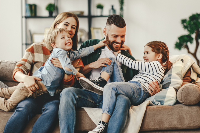 Family having fun on sofa