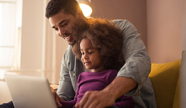 Father and Daughter learn at computer