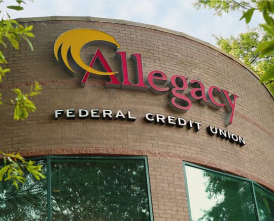 picture of the Allegacy sing on the exterior of the Queens Road Financial Center building