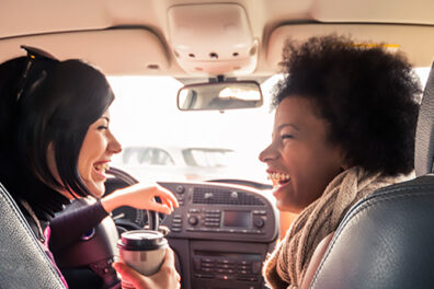 friends laughing in car