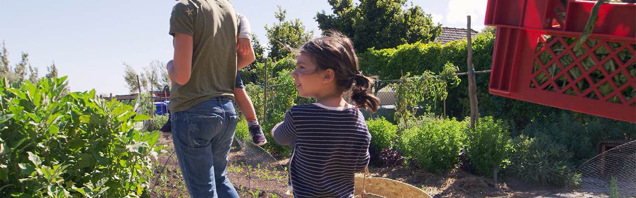 Family walking in garden