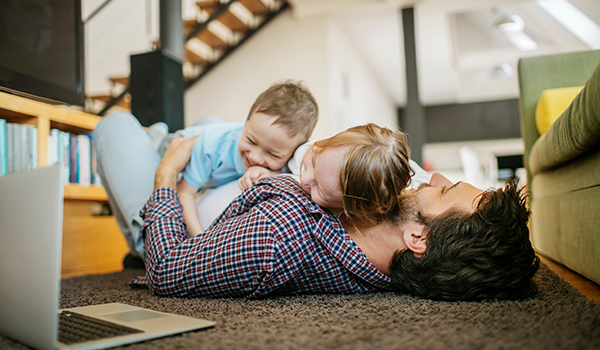 Children playing with dad on floor