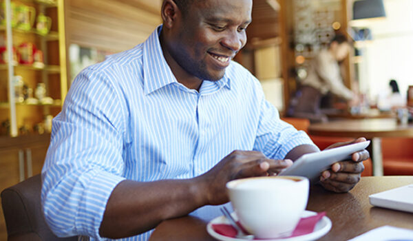 man enjoying morning coffee at cafe