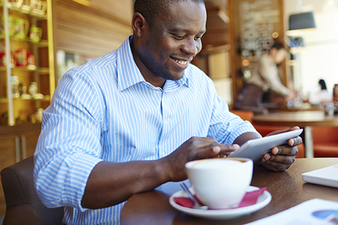 man enjoying morning coffee at cafe