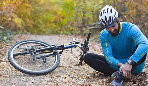 Injured ankle while biking in the autumn woods