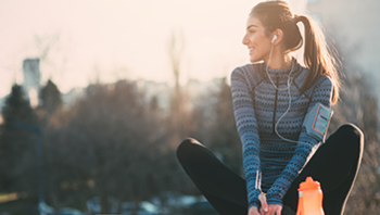 woman in active wear stretching in cold weather