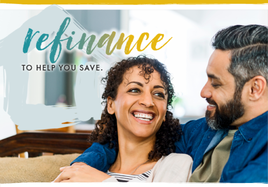 middle age couple smiling and embracing on couch