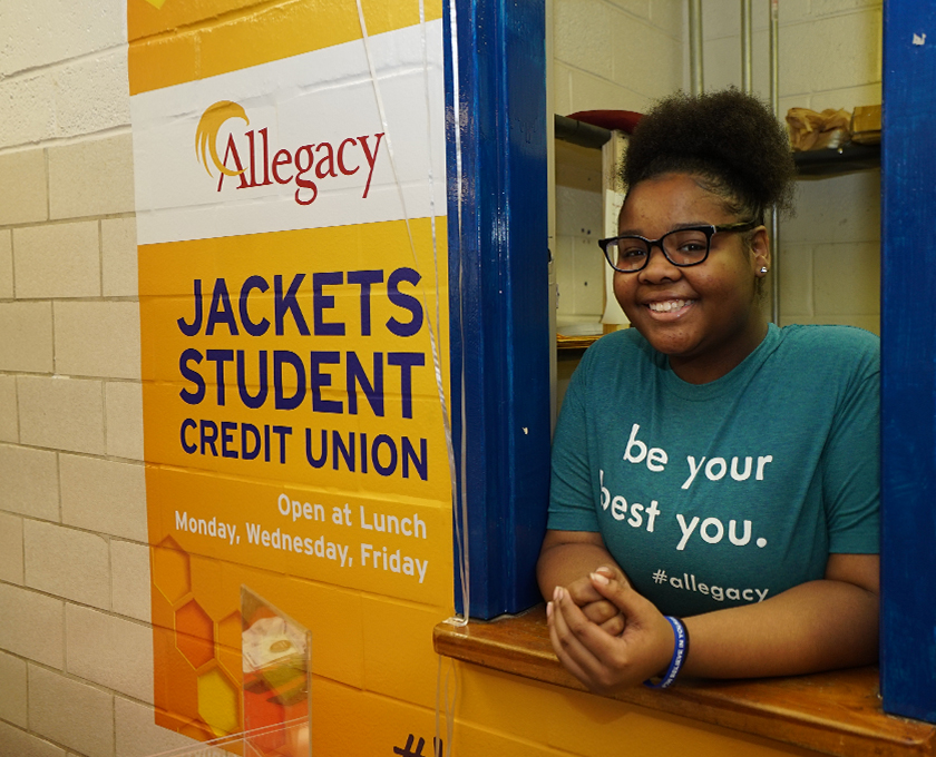 Smiling student at student credit union branch