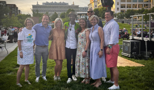 group photo of Allegacy and Summerlark team with event performer, Aloe Blacc.
