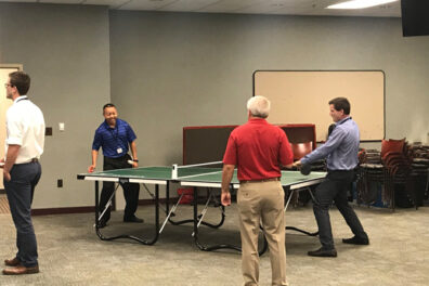 Group playing ping pong