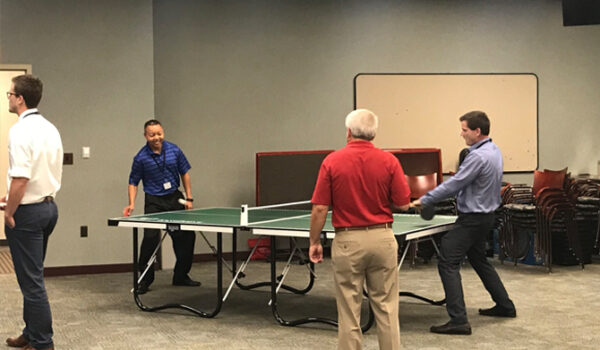 Group playing ping pong