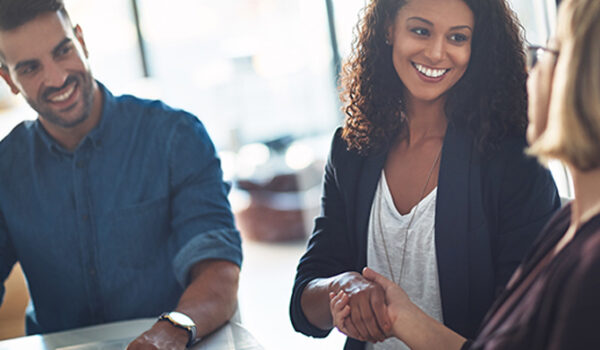 woman shaking hands in an office