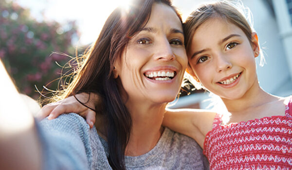 Mom + Daughter selfie in front of new home