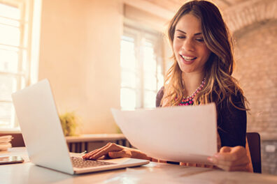 Woman typing on computer