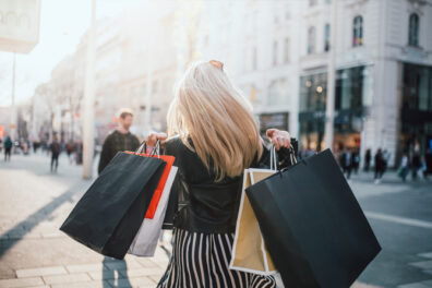 Woman with shopping bags in city