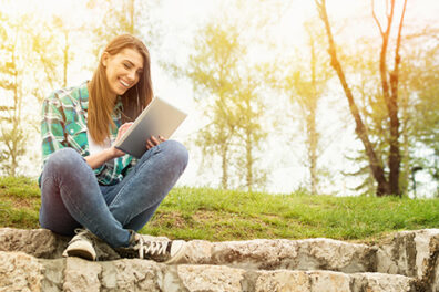 woman using tablet outside