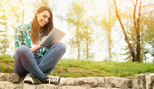 woman using tablet outside