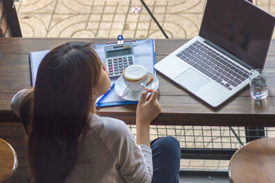 woman with coffee and laptop