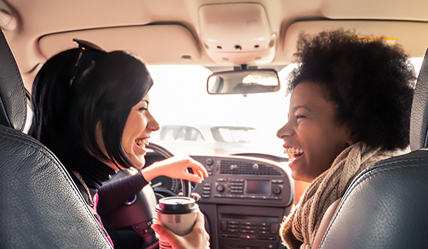 friends laughing in car