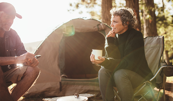 couple camping in woods