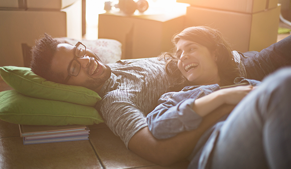 couple relaxing in new home