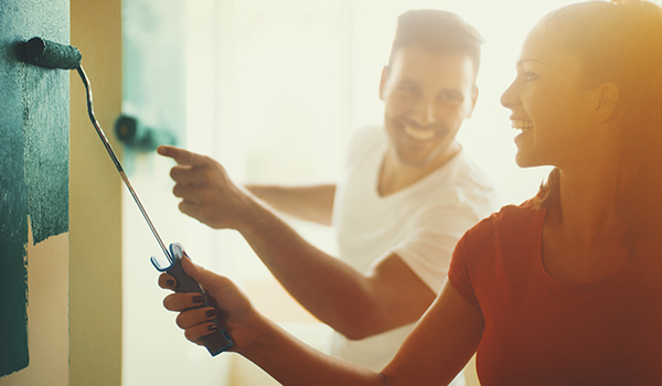 Couple painting at home